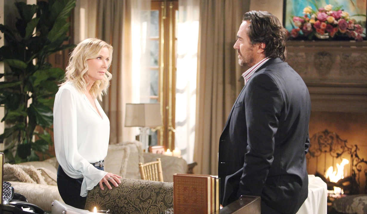 brooke and ridge standing across each other in a living room