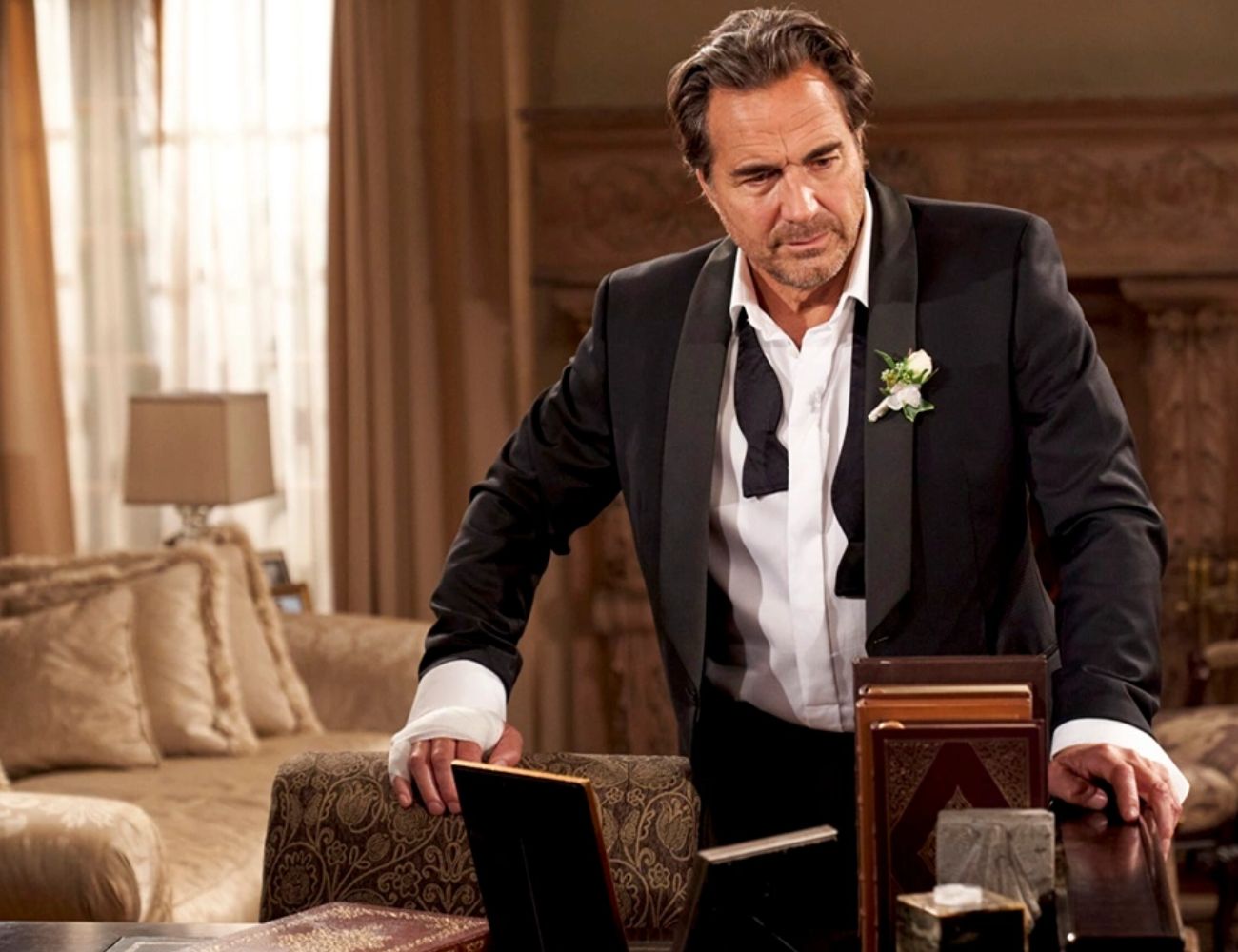 A still from the Bold and the Beautiful with Ridge in a tuxedo looking somber